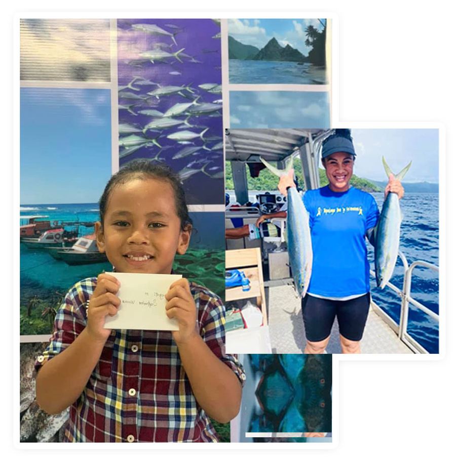 A young student holding a certificate, and a DMWR staff member holding two freshly caught fish on a boat